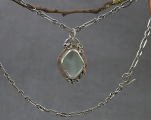 Barnacle encrusted sea glass necklace